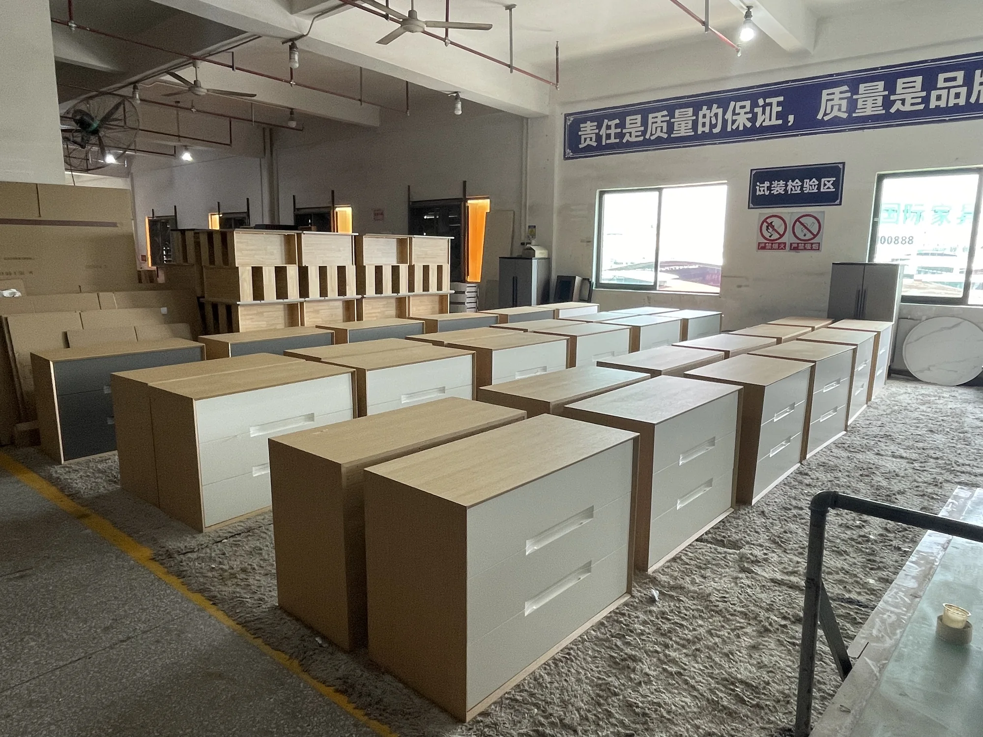 Completed cabinet pieces arranged for final acceptance