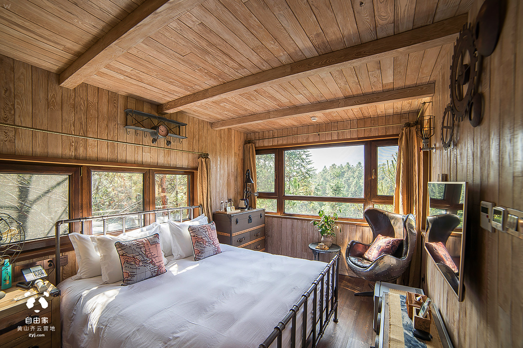Warm timber guestroom at ZYJ Treehouse Resort Hotel